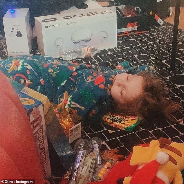 Swoon: Christina also shared a sweet photo of their six-year-old daughter, Summer Rain, wearing her pajamas on the floor after the inaugural gifts