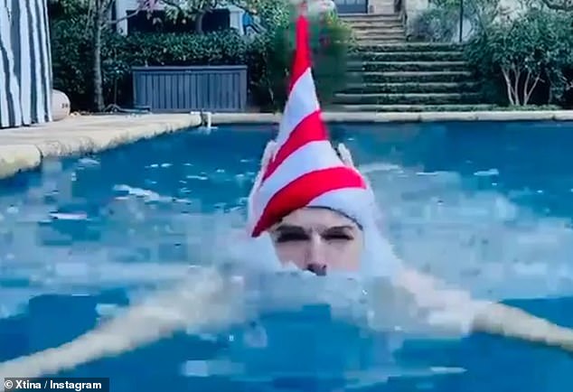 Chrismas diving: she included a video of her husband doing laps in the pool, dipping his hat underwater, with fake white beard and elf ears