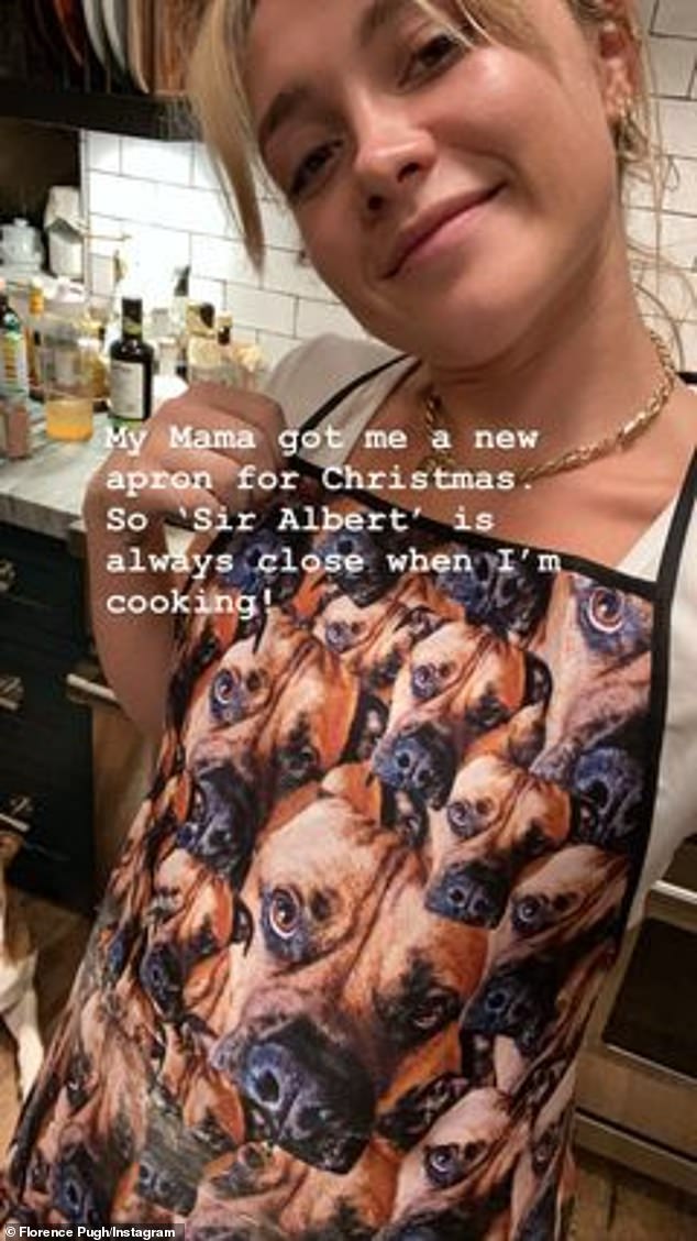 Lover of dogs: Florence was wearing a bib with her dog Sir Albert's face print on it that her mom got it for Christmas